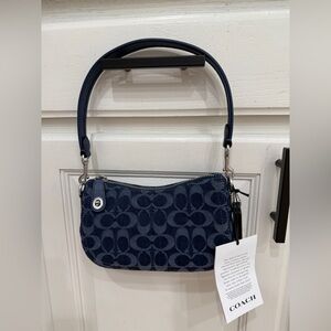 Coach Swinger 20 in signature denim
